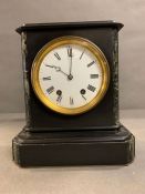 A marble and statue mantle clock stamped A.B