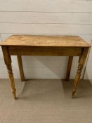 A pine side table (H73cm W84cm D44cm)