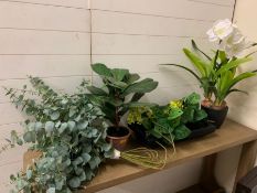 A selection of faux plants and long planter
