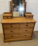 An antique pine chest of drawers with dressing table mirror (H78cm W106cm D48cm)