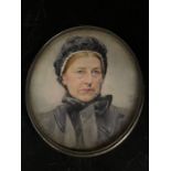 A Miniature portrait of woman with black bonnet by Percy Buckman, signed and dated (Possibly 1928)
