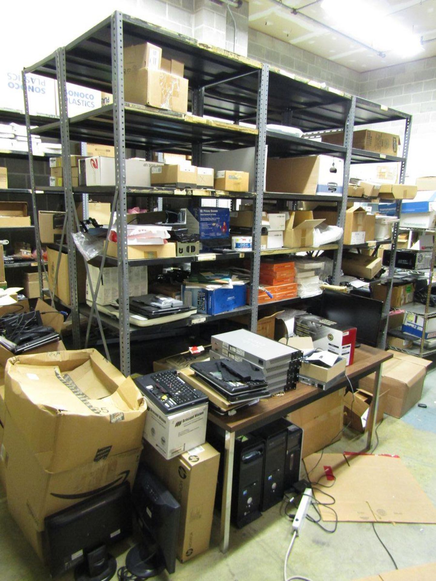 Lot - Contents of IT Repair Room, to Include: (26) Adjustable Shelving Units, Computer Monitors,