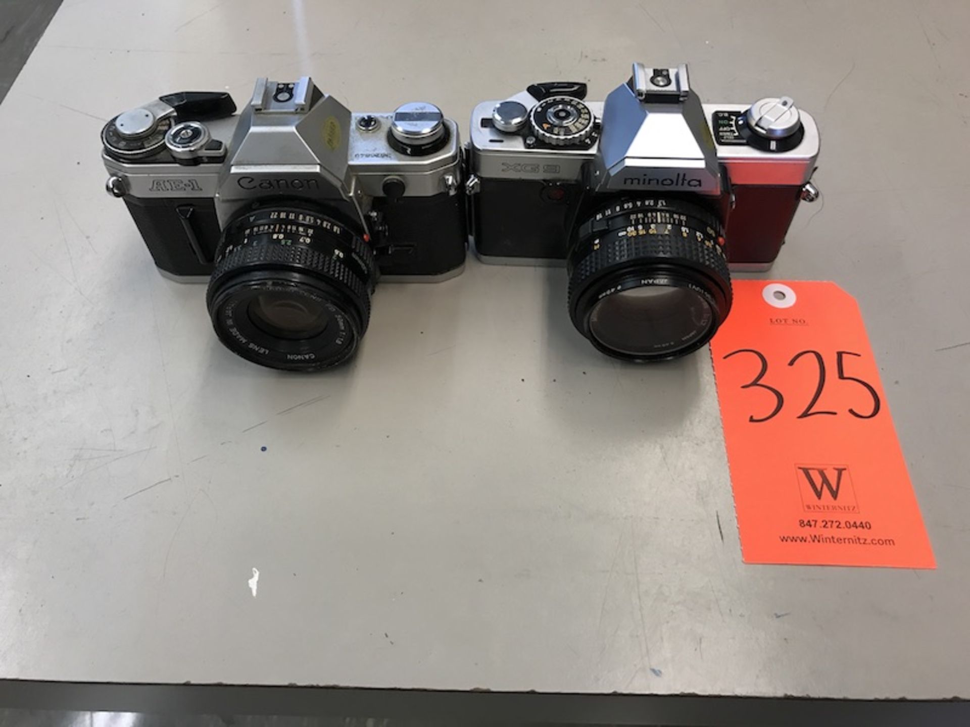 Lot - (1) Canon AE-1 Camera (1) Minolta XG9 Camera (Room 108)
