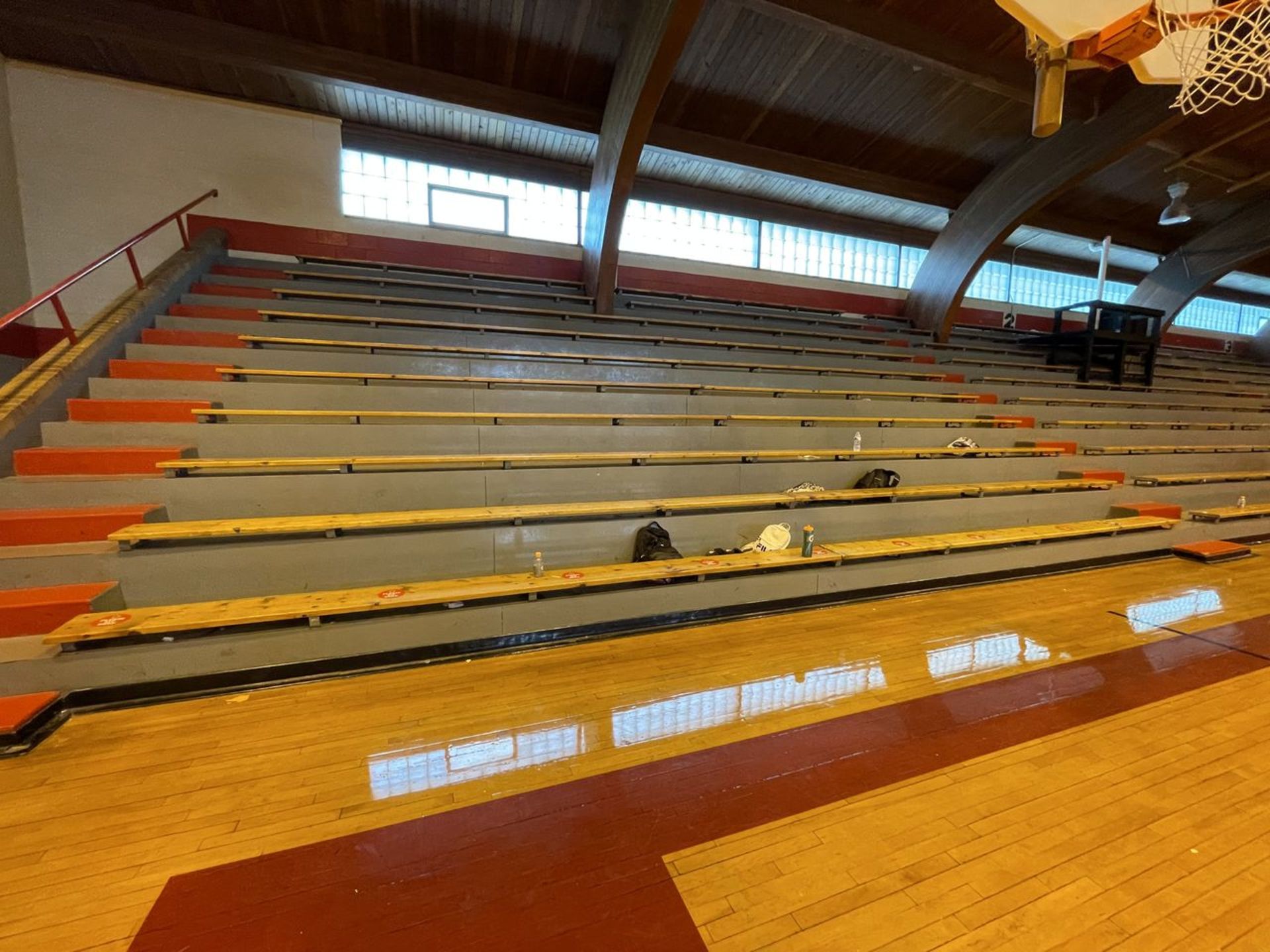 Lot - (58) 10 in. x 16 ft. Wood Benches Mounted on Permanent Bleachers (Gym)