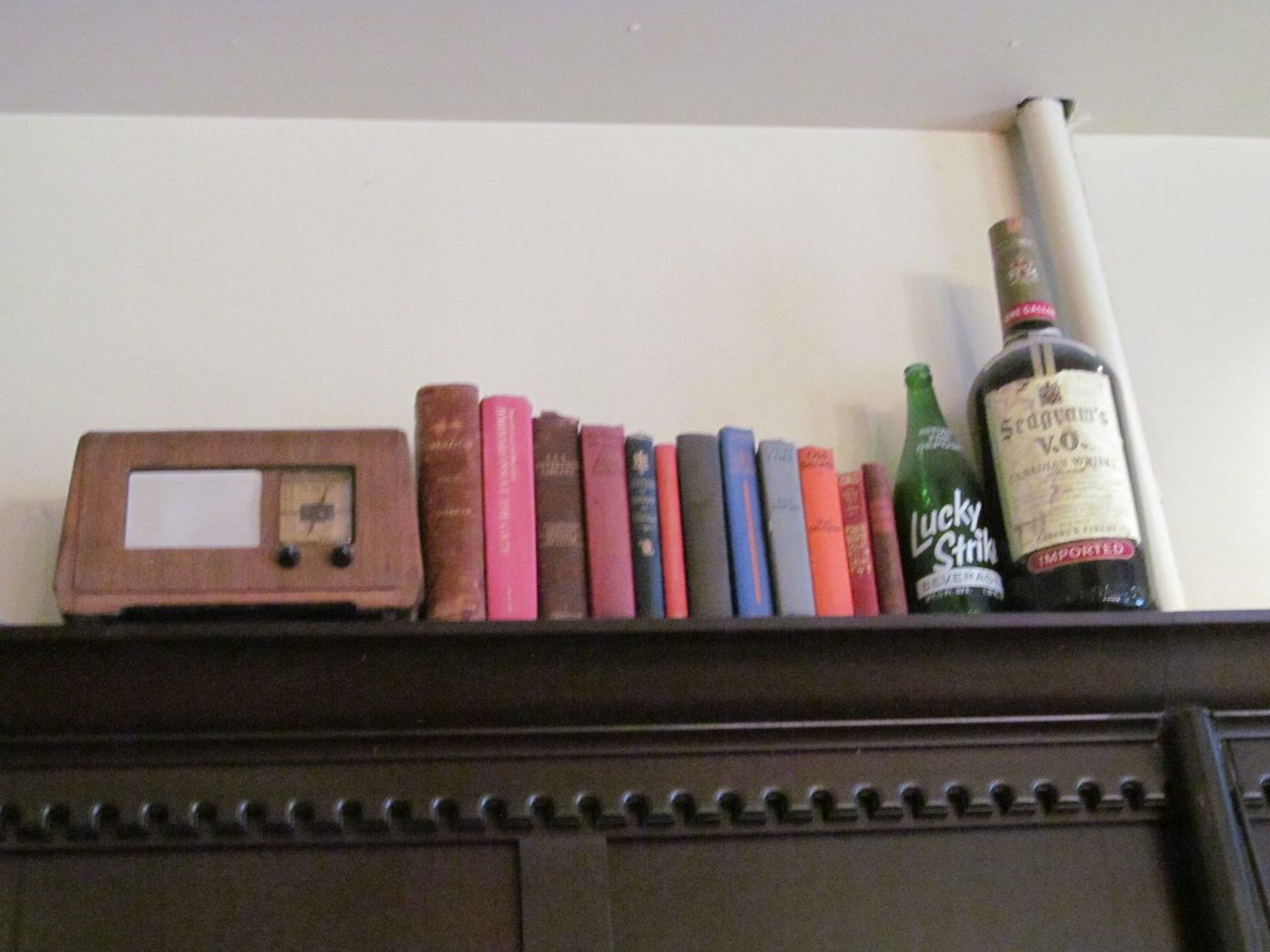 Lot - Antique Radio, Lucky Strike Bottle, Seagrams Bottle, and Assorted Books (Billiards Room)