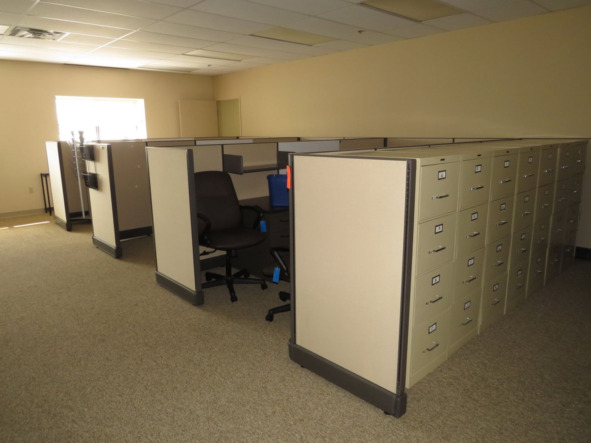 Office Furniture to Include: (4) Sections of Cubicles, (3) L-Shaped Desks, (7) 4-Drawer Metal