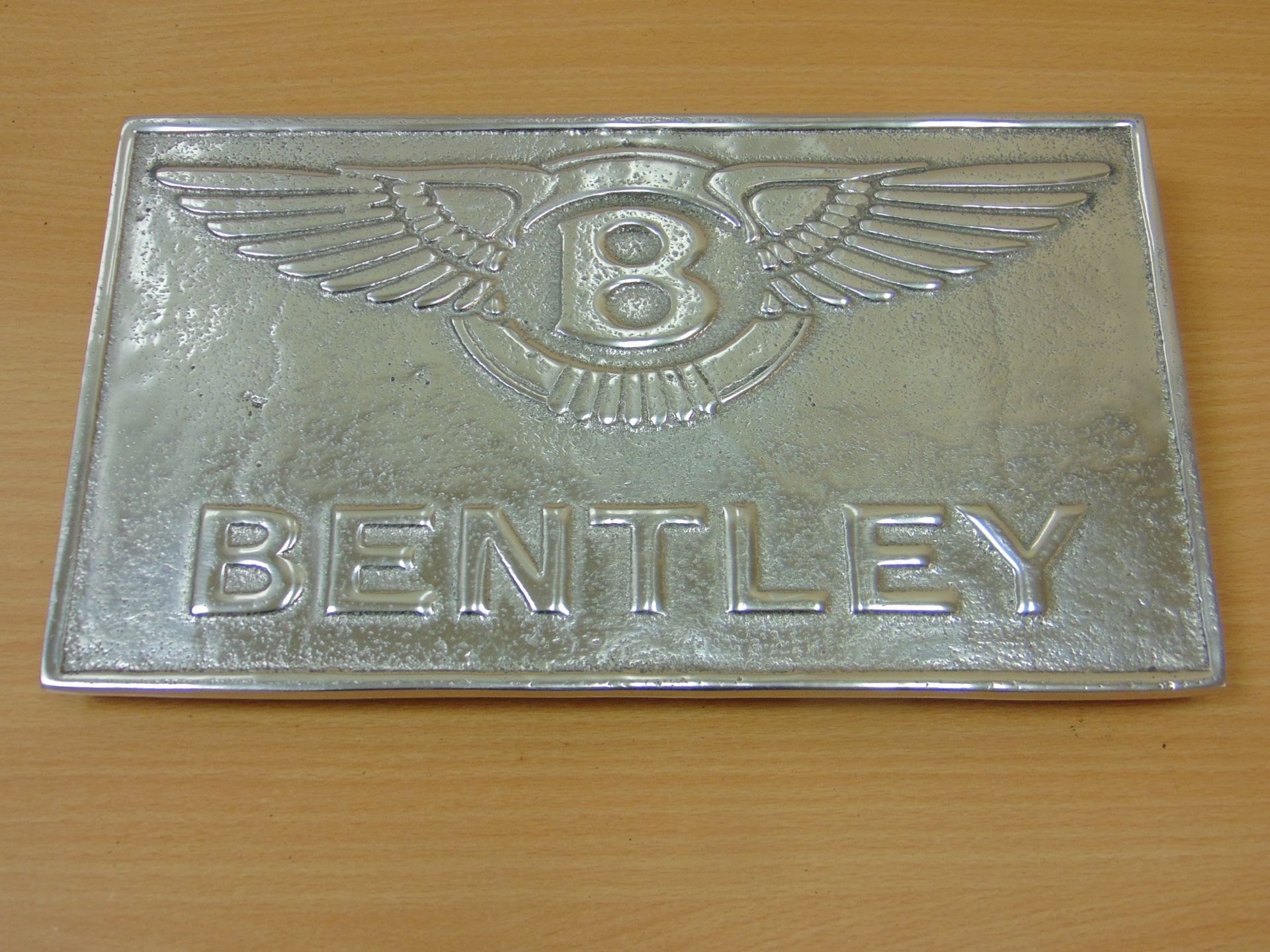 BENTLEY POLISHED ALUMINIUM ADVERTISING SIGN.