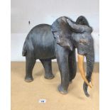 Hand carved hardwood African Elephant in standing stance, approx. H46cm, A/F to ear