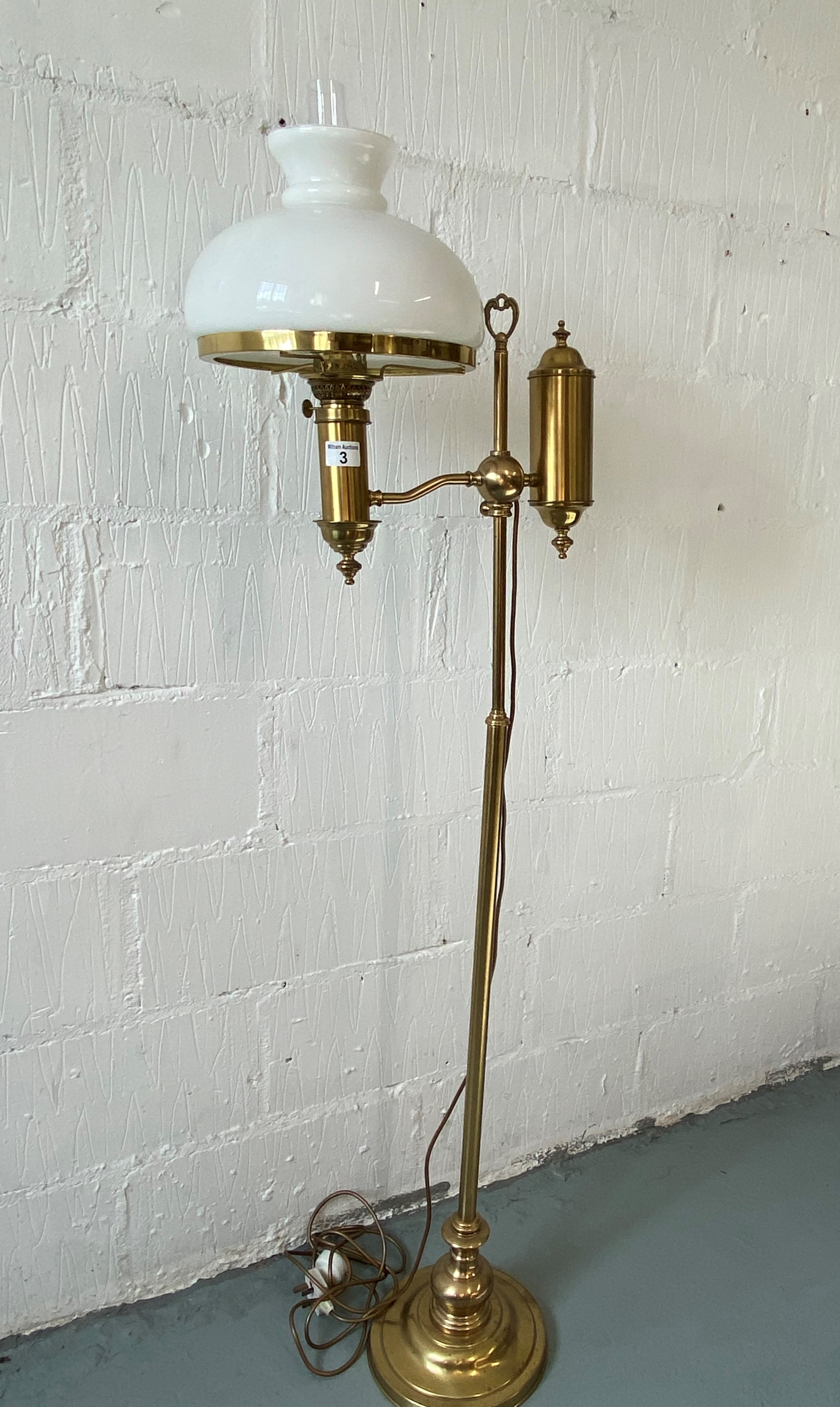 Standard brass floor lamp converted to electric, with glass funnel and glass shade