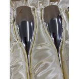 Boxed set of six silver coloured and gilt champagne flutes with matching stopper (P&O Cruises)