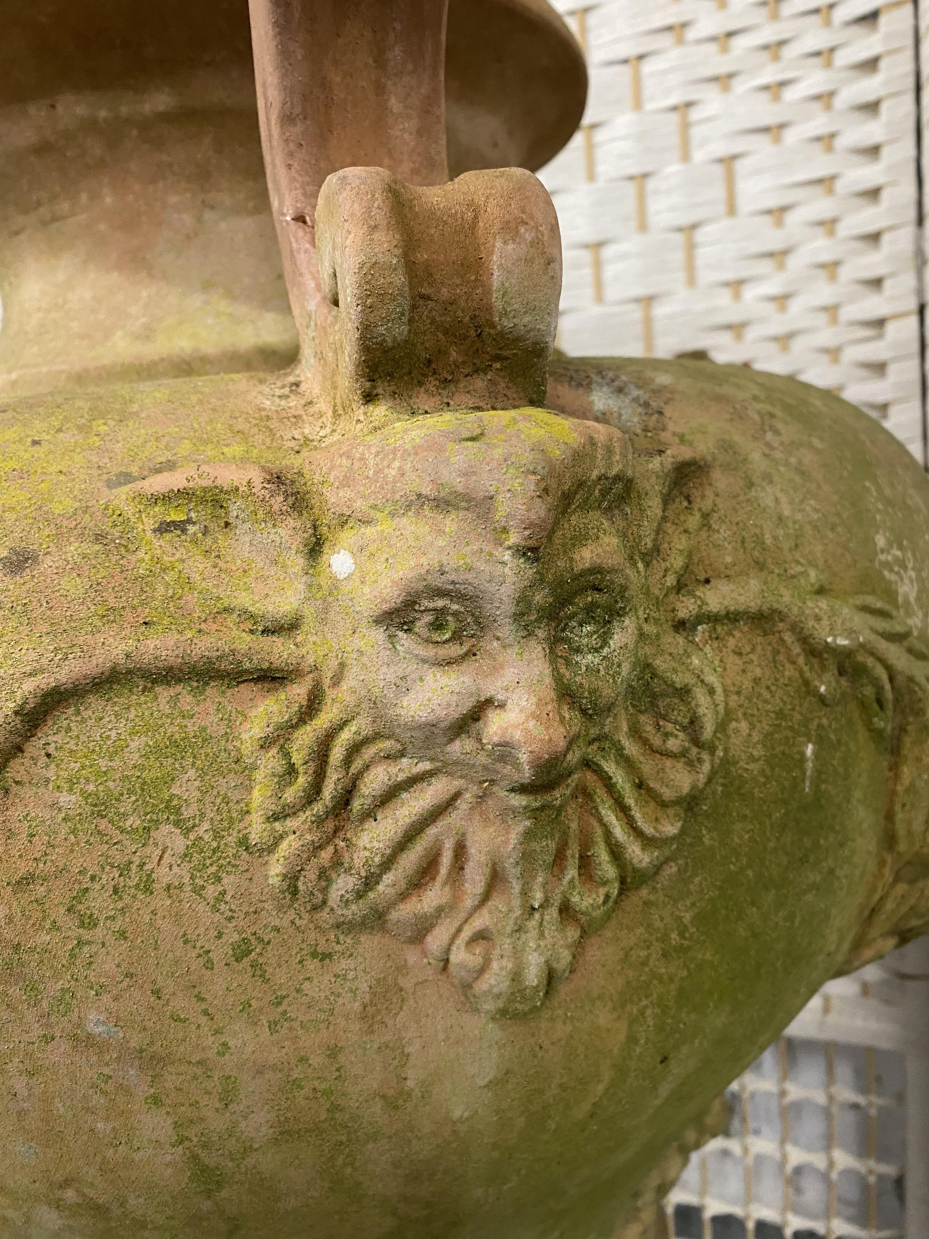Two oversized Italian terracotta urns with twin handles, relief decorated with swags and lions. - Image 3 of 4