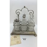 Victorian cut glass and silver plate cruet set comprising six various bottles sitting in a