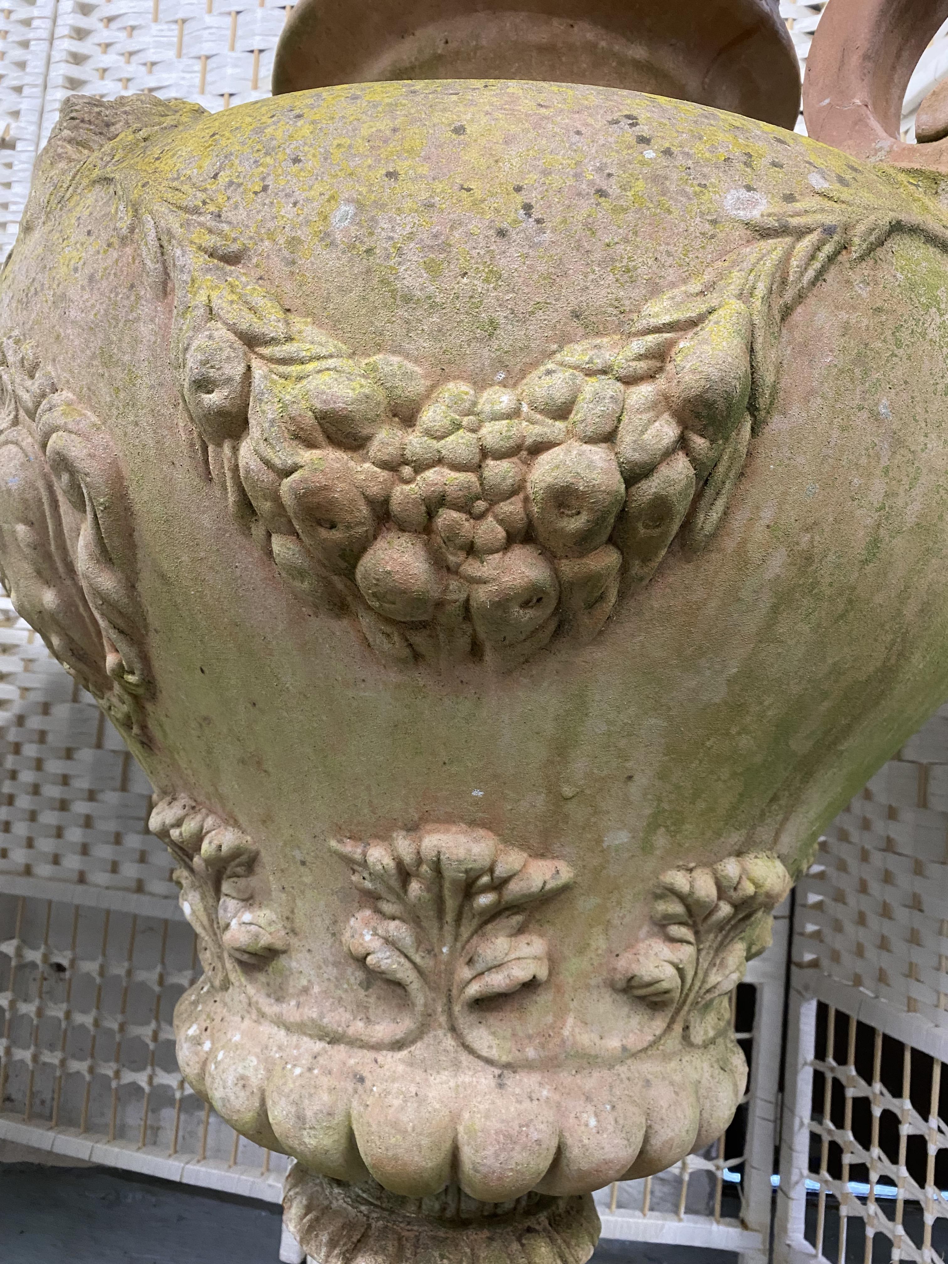 Two oversized Italian terracotta urns with twin handles, relief decorated with swags and lions. - Image 2 of 4