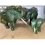 Two hand carved green stone African animals, signed by artists A/F plus three hand carved graduating