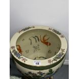 A large glazed oriental vase/planter with fish scenes to interior, on hardwood stands, with