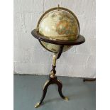 Royal Geographical Society World Globe, raised on tripod stand with gilt detailing , approx. H100cm