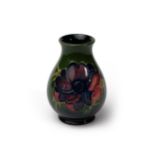 Moorcroft anemone vase on green ground, approx. H9.5cm, no stamp to base