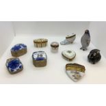 An assortment of porcelain trinket/pill boxes (x8 in total) plus x2 small enamel animal figures in