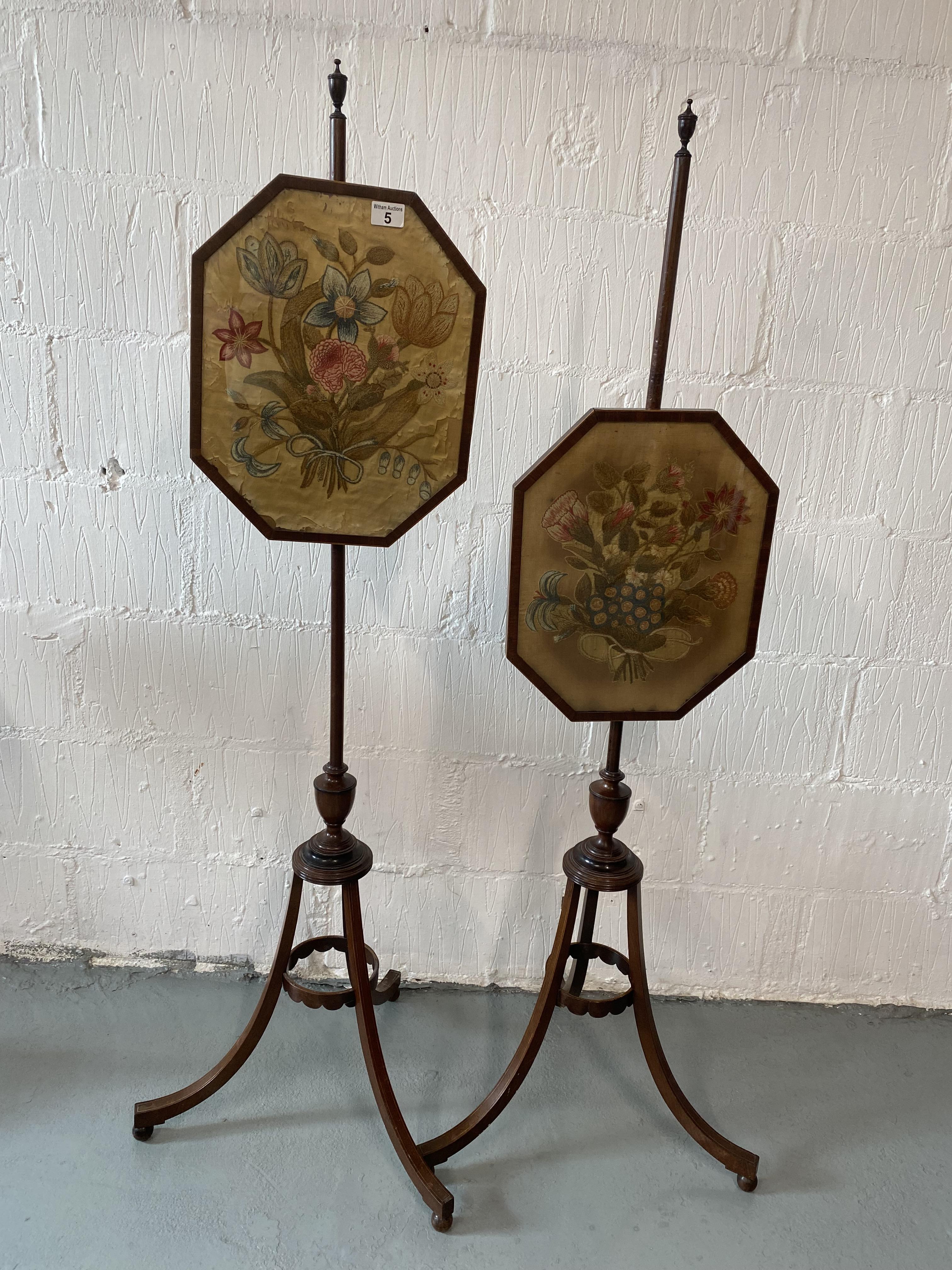 Two Regency tripod pole screens, each with a needlepoint silk floral spray panel, the boxwood strung