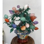 Chinese cloisonne planter containing ornamental tree with a mixture of semi precious stones of