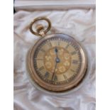 A gold ladies pocketwatch with engraved detailing to outer case, floral design to face with roman