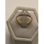 18ct yellow and white gold diamond solitaire in a square setting , approx 0.40ct,