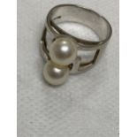 A white gold cultured twin pearl ring of modern design, approx size K K14WG