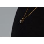 Yellow gold necklace with 0.33ct diamond solitaire pendant marked as 9ct gold