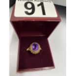 9ct gold ring set with central amethyst oval stone, hallmarked Birmingham, approx size O