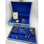 A blue jewellery box containing a quantity of predominately silver items but to include A pair of