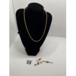 gold rope chain necklace with gold brooch and scrap gold