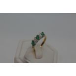 18ct yellow gold marquise cut five stone emerald and diamond ring. Approx E0.75ct, D0.50ct.