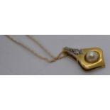 A 14ct yellow gold pendant with Pearl and diamond, stamped 585 with gold chain marked ZRT 10K