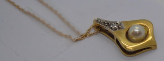 A 14ct yellow gold pendant with Pearl and diamond, stamped 585 with gold chain marked ZRT 10K