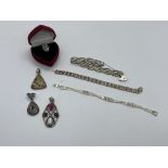 A quantity of silver jewellery including three pendants stamped 925, two silver link design