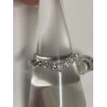 Platinum diamond wishbone ring, approx size N, approx gross weight 4g.This item has been consigned