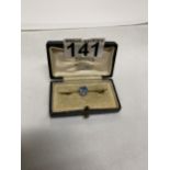 A vintage 9ct yellow gold bar brooch with central blue stone possible aquamarine in vintage box,