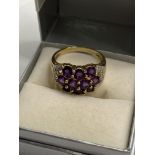 A 9ct yellow gold with purple stone (poss amethyst) cluster ring, hallmarked Birmingham QVC