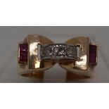 18ct yellow gold tank ring with three clear stones to central bridge design and two square cut red