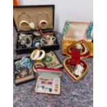 A large quantity of costume jewellery including jewellery boxes, rings, earrings necklaces, brooches