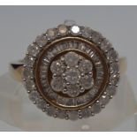 9ct gold diamond cluster ring with a radiating circular design of varying cut diamonds of approx