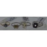 Three modern TGGC gemstone white and yellow gold rings all marked 10k, plus one silver split ring