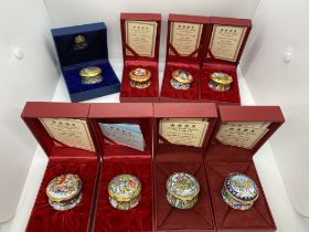 Christmas themed ceramic trinket boxes by Halcyon Days consecutively dating from 2000 to 2007. All