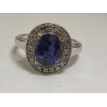 18ct white gold oval design dress ring with sapphire and diamond surround, approx size O, stamped