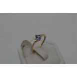 9ct yellow gold Tanzanite and diamond ring. Central Tanzanite stone of pear shaped form,