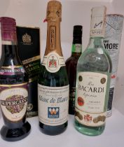 A quantity of unopened bottles of alcohol including Bacardi, Johnnie Walker Black Label and Armore