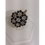 A 9ct yellow gold diamond and Sapphire cluster ring, hallmarked 375 London approx size P