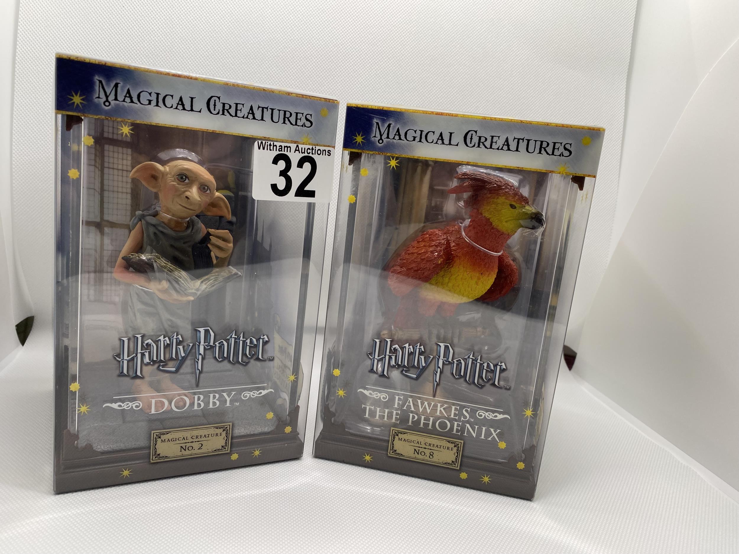 Two boxed Warner Brothers Harry Potter Magical Creatures figures no.2 ‘Dobby’ and no.8 'Fawkes the