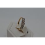18ct yellow gold diamond ring, approx size N. Graduating diamond design approx total 0.50ct,