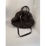 Original and unused Italian brown leather handbag with cream stitching and chromed zip, by Salvatore